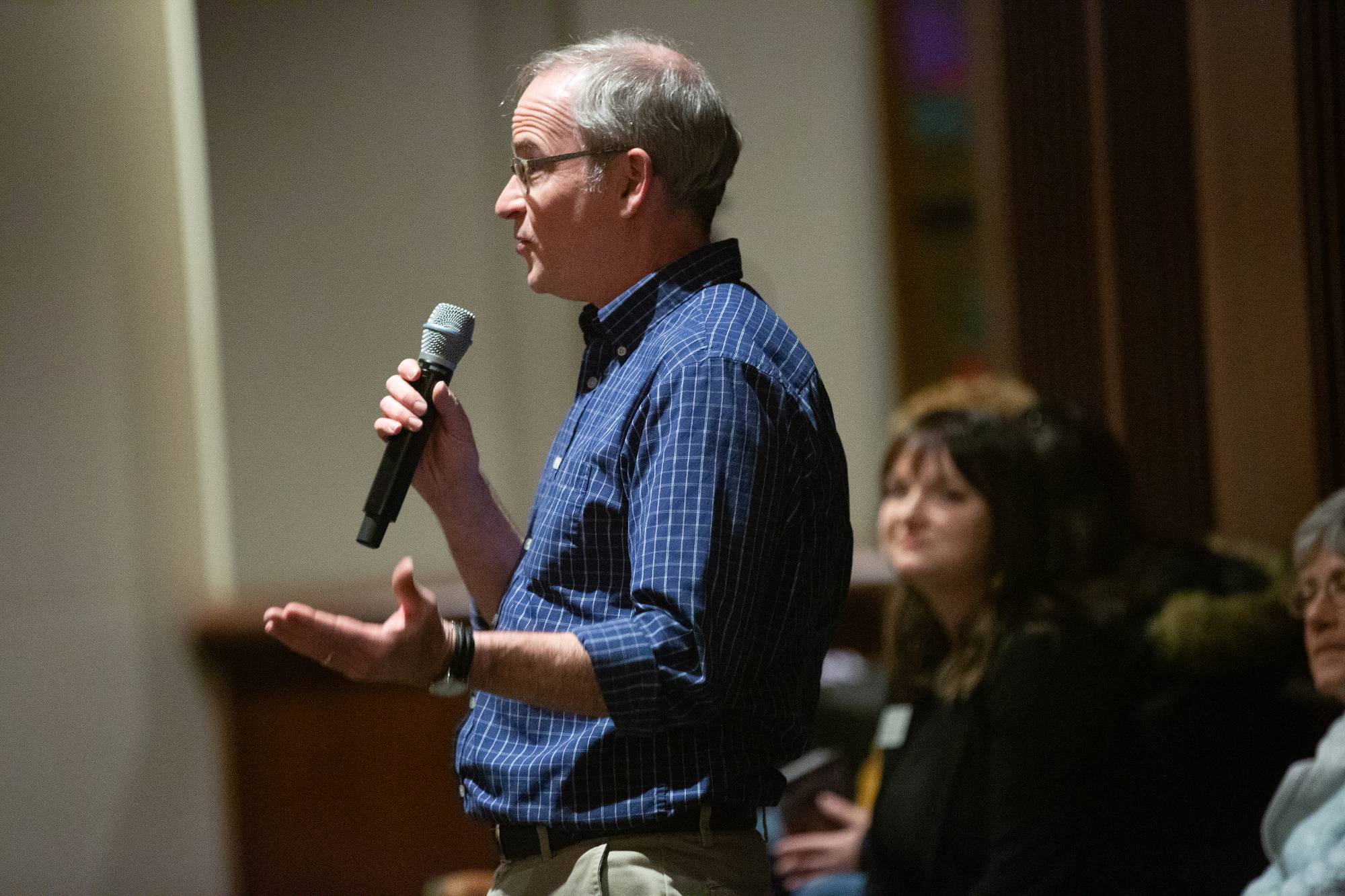 two people sitting on stage